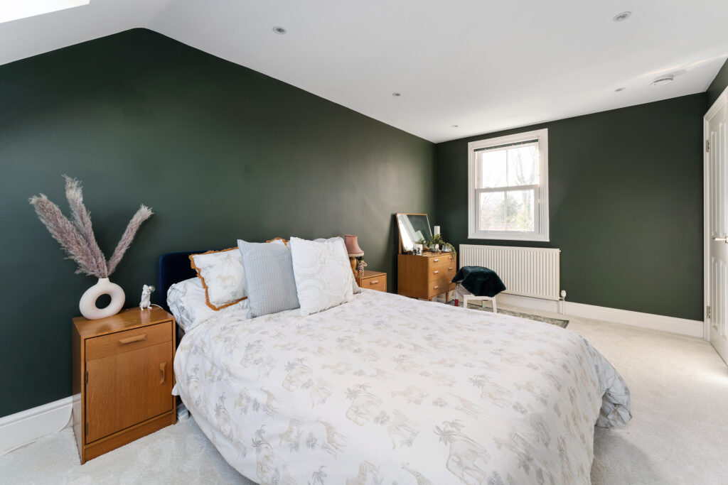 A bedroom made from a hip to gable loft extension