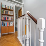 view of a staircase and hallway in double pitched mansard loft conversion