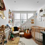 Cozy loft conversion nursery with natural light, playful decor, and space-saving design. Perfect for growing families.