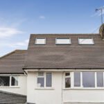 Modern loft conversion with skylights in suburban home. Perfect solution for extra space and natural light.