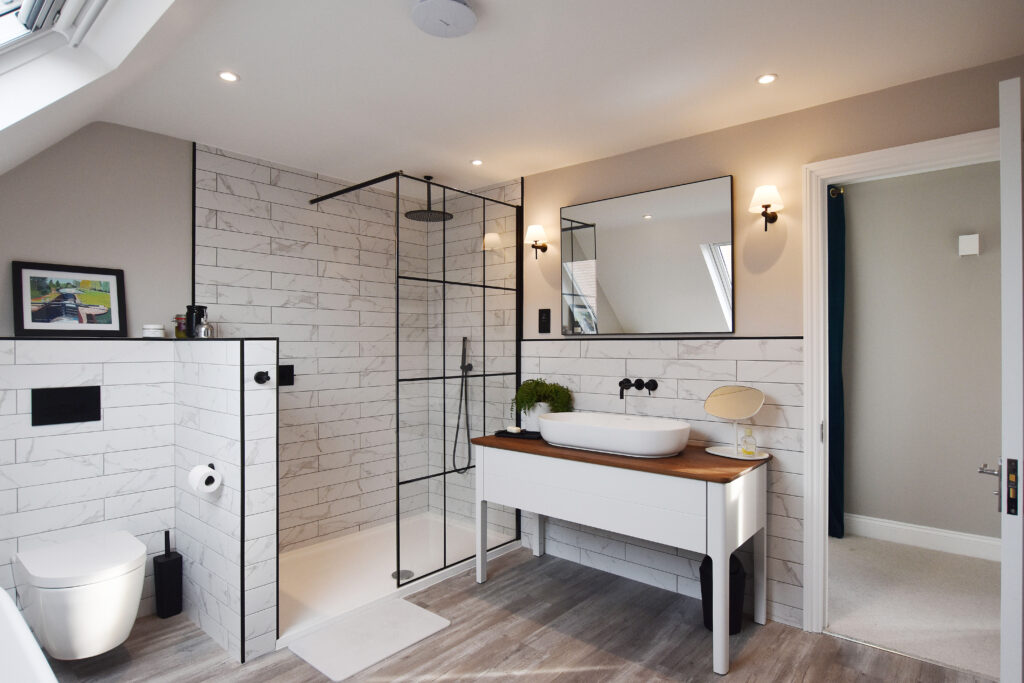 Modern loft conversion bathroom with sleek shower, elegant vanity, and contemporary design.
